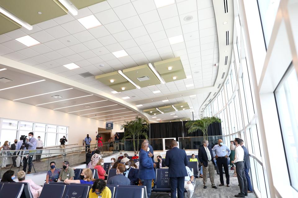The new airport terminal is filled with people during a ribbon cutting ceremony at the Gainesville Airport, in Gainesville, Fla. July 29, 2021.