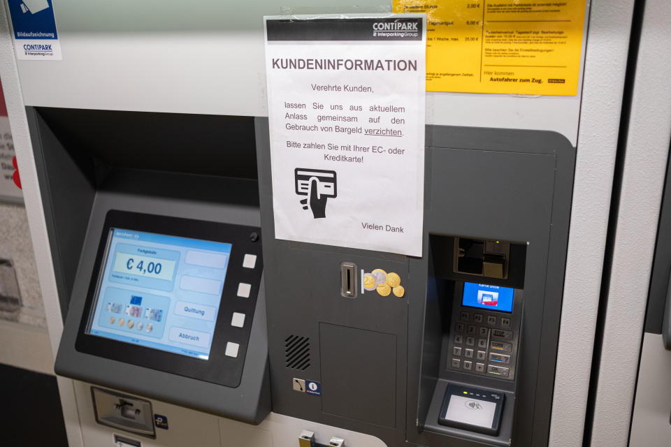 17 March 2020, Lower Saxony, Hanover: A customer information for current reasons to pay with EC or credit card instead of cash is displayed at a parking fee machine in Hanover. Photo: Peter Steffen/dpa (Photo by Peter Steffen/picture alliance via Getty Images)