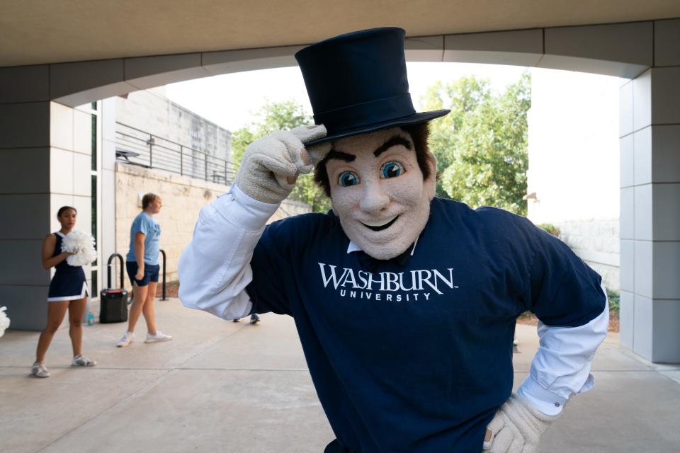 Mr. Ichabod gives a tip of his hat Thursday morning to those moving into the Living Learning Center at Washburn University.
