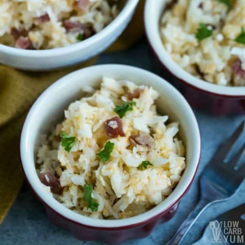 <p>Why stick with traditional fried cauliflower rice? This version with bacon and cheese is a nice change.</p><p><strong>Get the recipe here: <a href="https://lowcarbyum.com/cheesy-cauliflower-rice/" rel="nofollow noopener" target="_blank" data-ylk="slk:Cheesy Cauliflower Rice;elm:context_link;itc:0;sec:content-canvas" class="link ">Cheesy Cauliflower Rice</a></strong></p>