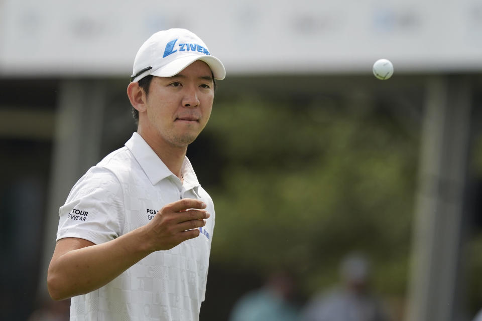 S.Y. Noh, of South Korea, tosses his ball after putting on the 18th hole during the first round of the Byron Nelson golf tournament in McKinney, Texas, Thursday, May 11, 2023. (AP Photo/LM Otero)