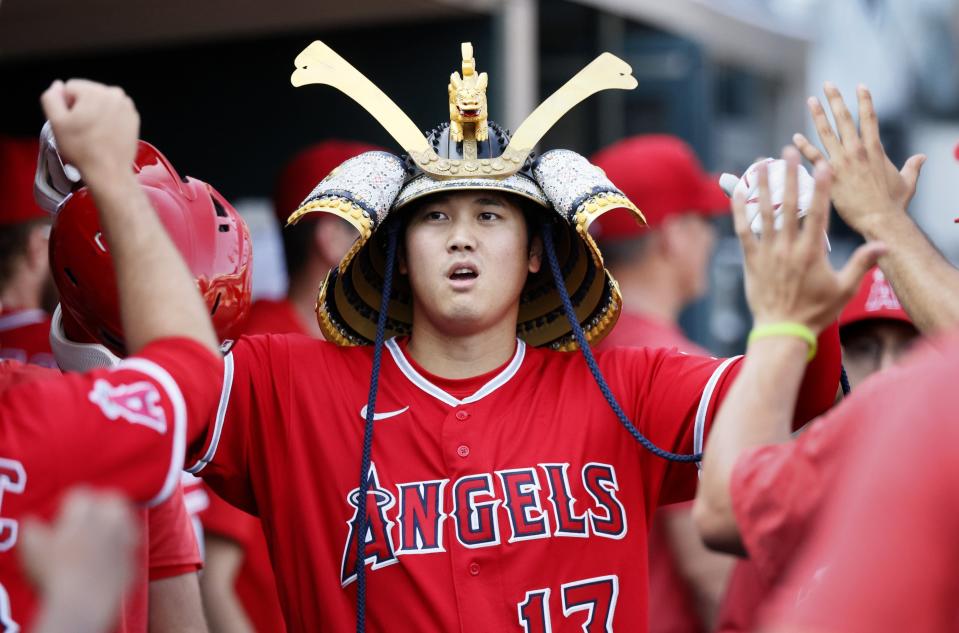 Angels DH Shohei Ohtani celebrates with teammates after hitting a home run during the fourth inning of Game 2 of a doubleheader on Thursday, July 27, 2023, at Comerica Park.