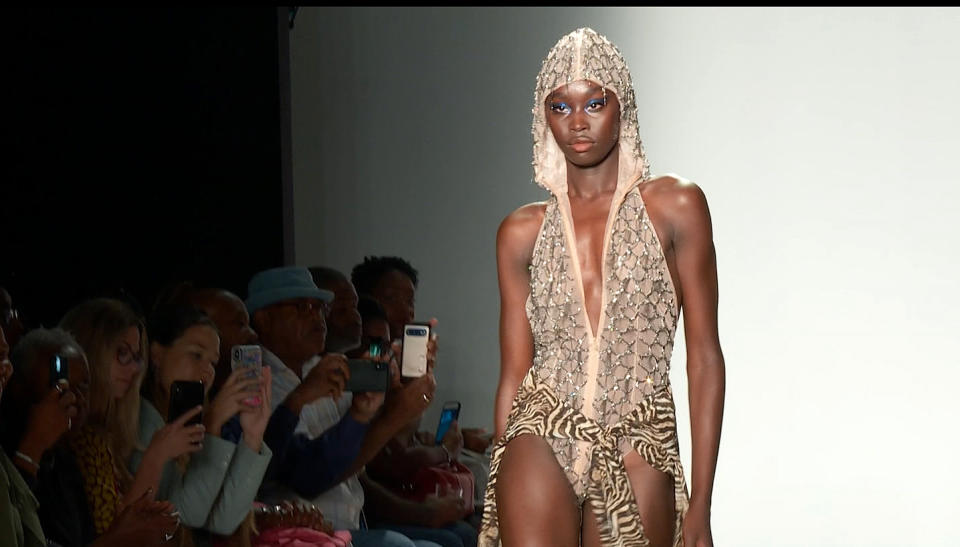 This Sept. 8, 2019 photo taken from video shows the latest fashion by LaQuan Smith being modeled during Fashion Week in New York, Sunday, Sept. 8, 2019. (AP Photo/Aron Ranen)