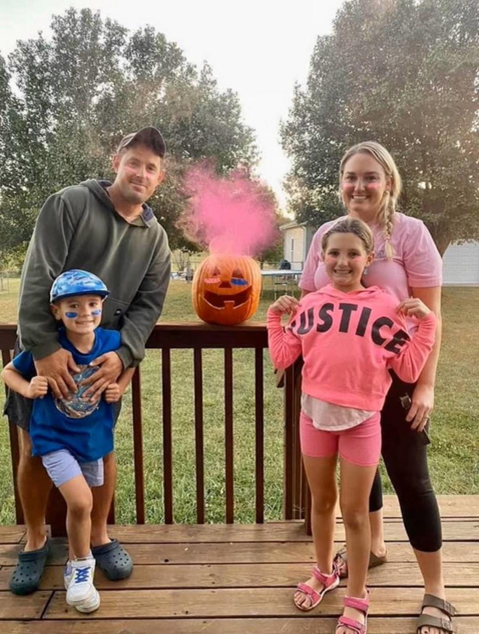 Rachael Hilton, right, with her husband, Justin, and their children, Ava and Landon, revealing the gender of Hilton’s pregnancy in October 2022. They named her Charlotte, and she was eventually diagnosed with a series of fatal conditions. Hilton could not get an abortion in Kentucky under the state’s bans. She miscarried in December of that year.