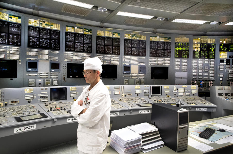 In this photo taken on Tuesday, July 16, 2019, a control panel engineer Michail Nefedjev stands at the control panel of the Ignalina nuclear power plant (NPP) in Visaginas some 160km (100 miles) northeast of the capital Vilnius, Lithuania. The HBO TV series “Chernobyl” featuring Soviet era nuclear nightmares is drawing tourists to the atomic filming locations and helping Lithuania grow as a tourist destination. (AP Photo/Mindaugas Kulbis)