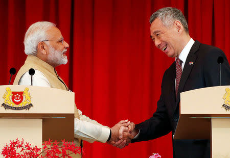 India’s Prime Minister Narendra Modi shakes hands with Singapore’s Prime Minister Lee Hsien Loong at the Istana in Singapore June 1, 2018. REUTERS/Edgar Su