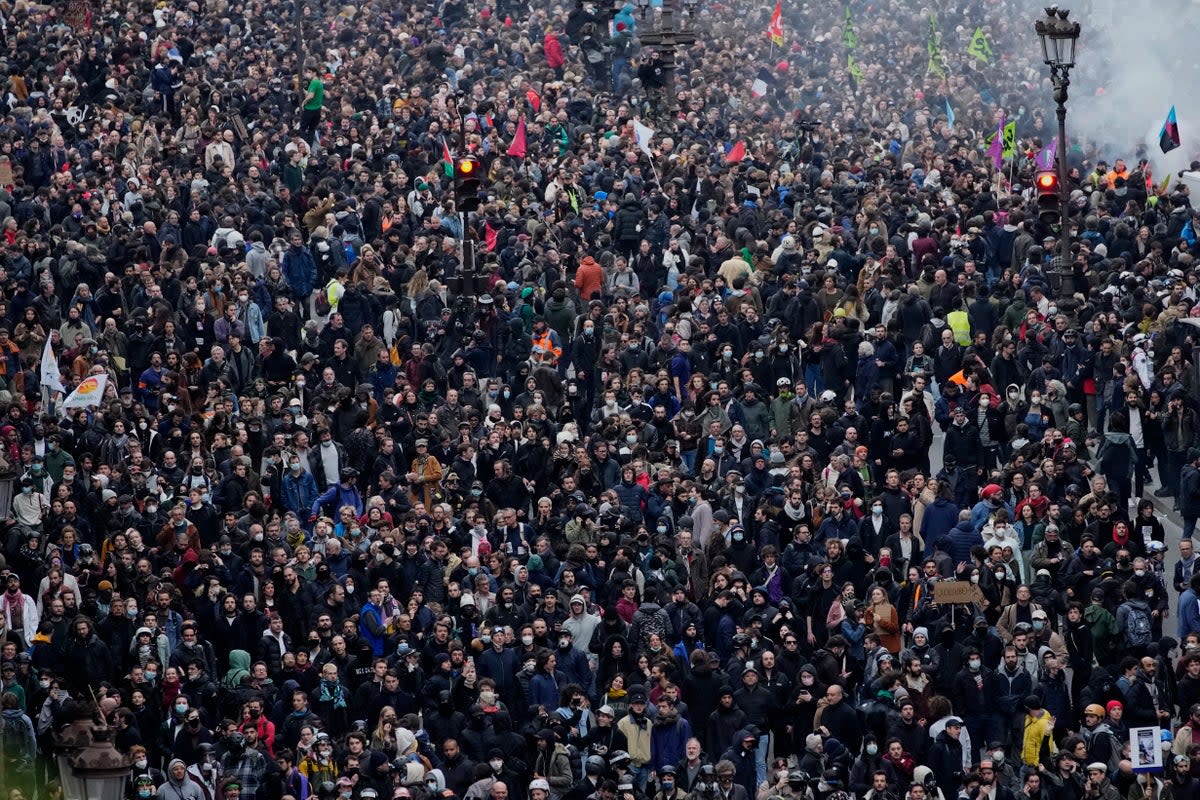 Protesters march during a rally in Paris on Thursday (AP)