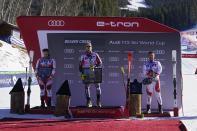 Norway's Aleksander Aamodt Kilde, center, celebrates a first place finish while posing with second-place finisher Austria's Matthias Mayer, left, and third-place finisher Switzerland's Beat Feuz after a men's World Cup downhill ski race Saturday, Dec. 4, 2021, in Beaver Creek, Colo. (AP Photo/Gregory Bull)