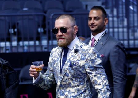 FILE PHOTO - UFC lightweight champion Conor McGregor of Ireland arrives for a post-fight news conference at T-Mobile Arena in Las Vegas, Nevada, U.S. August 26, 2017. REUTERS/Steve Marcus