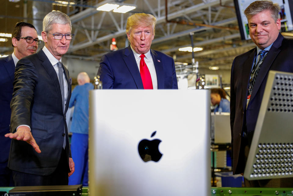 Apple CEO Tim Cook escorts U.S. President Donald Trump as he tours Apple's Mac Pro manufacturing plant with in Austin, Texas, U.S., November 20, 2019. REUTERS/Tom Brenner