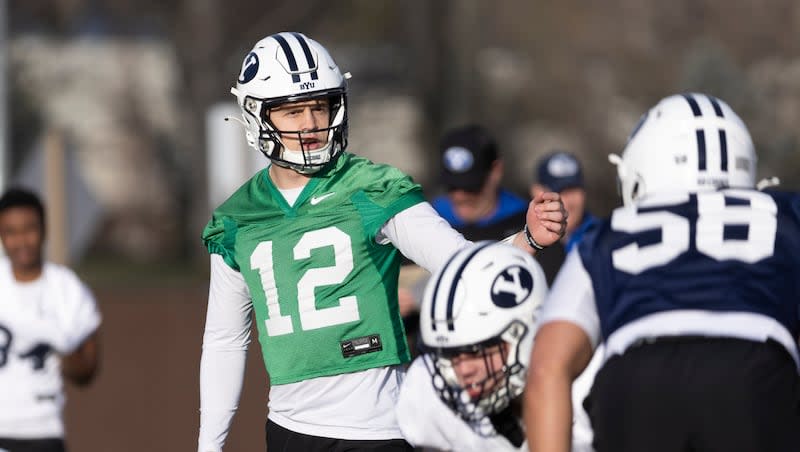 BYU quarterback Jake Retzlaff gestures to his teammates during a practice on the SAB outdoor practice fields at the start of spring camp in Provo on Thursday, Feb. 29, 2024.