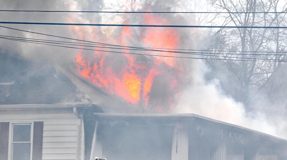 Fire engulfs a home Tuesday afternoon, Feb. 21, 2023, on West Virginia Avenue in Bessemer City.