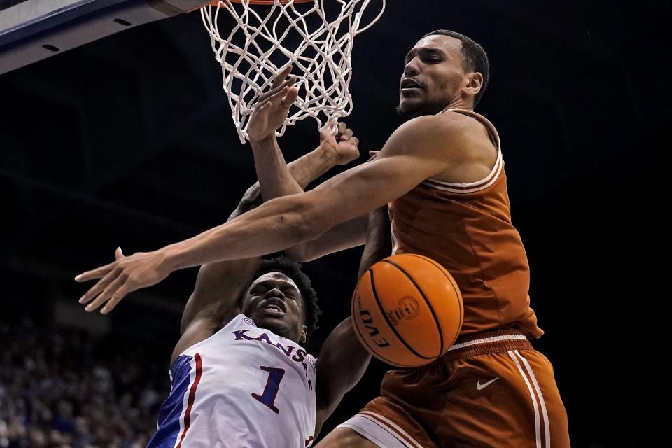 Texas forward Dylan Disu, right, knocks the ball away from Kansas guard Joseph Yesufu during the first half Monday night. The Longhorns' next game is Saturday at home against West Virginia.