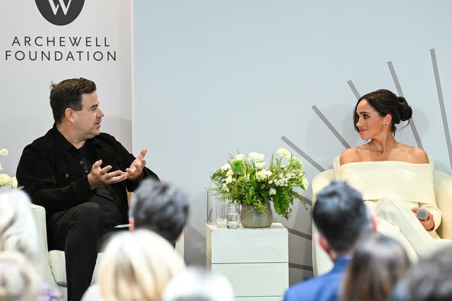 <p>Bryan Bedder/Getty</p> Carson Daly and Meghan Markle in discussion during a summit on mental health
