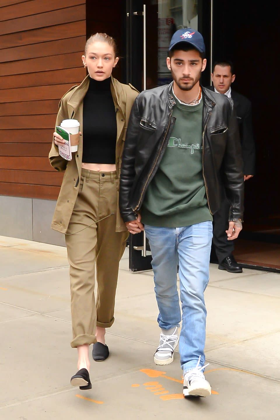 <p>In a black turtleneck crop with an oversized cargo jacket, loose-fitting pants and black leather mules while leaving her NYC apartment with her boyfriend Zayn.</p>