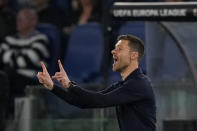 Leverkusen's head coach Xabi Alonso shouts out as gives instructions from the side line during the Europa League semifinal first leg soccer match between Roma and Bayer Leverkusen at Rome's Olympic Stadium in Rome, Italy, Thursday, May 2, 2024. (AP Photo/Andrew Medichini)
