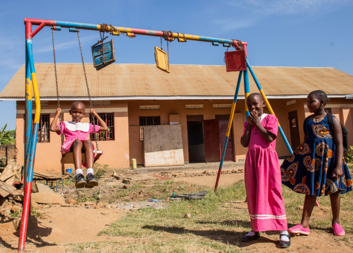 Students play outside a classroom at the Mbale Primary School, after schools reopened following the coronavirus disease (COVID-19) induced shutdown in Mbale, Uganda, January 10, 2022.