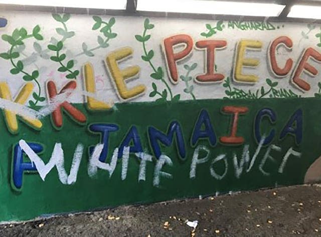 Racist graffiti on a Windrush mural in Port Talbot