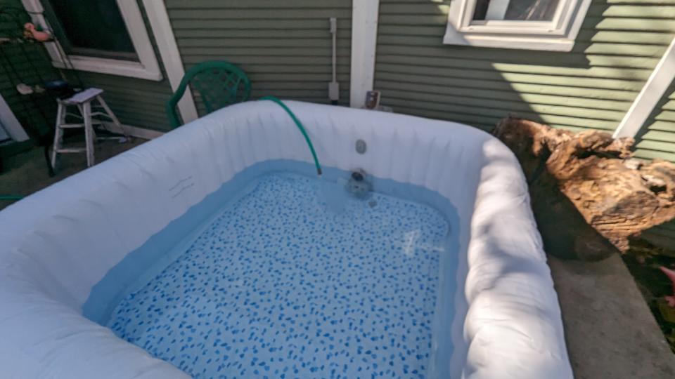 Filling the hot tub with water