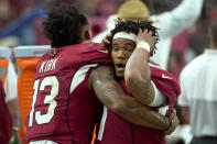 Arizona Cardinals quarterback Kyler Murray reacts with wide receiver Christian Kirk (13) during the final seconds of an NFL football game against the Detroit Lions, Sunday, Sept. 8, 2019, in Glendale, Ariz. The Lions and Cardinals played to a 27-27 tie in overtime. (AP Photo/Rick Scuteri)