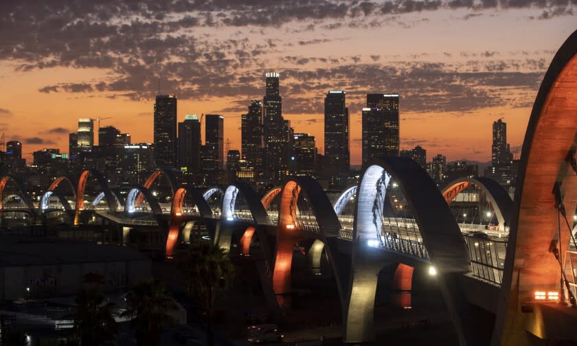 Los Angeles, CA - July 27: Clouds float over downtown Los Angeles and the new 6th Street Bridge, which has been closed intermittently since opening due to street racing and other illegal activity on Wednesday, July 27, 2022 in Los Angeles, CA. (Brian van der Brug / Los Angeles Times)