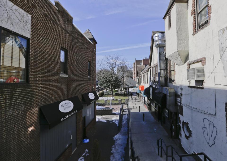 In this March 6, 2014 photo, a walkway leading past the entrance of 82-70 Austin Street is shown in the Queens borough of New York. The 50th anniversary of the killing of Kitty Genovese's, whose screams could not save her the night she was stalked and killed in the neighborhood on March 13, 1964, is on Thursday. (AP Photo/Frank Franklin II)