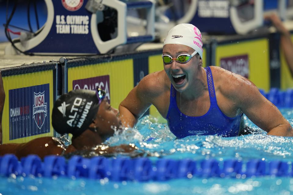 Simone Manuel and Abbey Weitzeil react after the women's 50 freestyle during wave 2 of the U.S. Olympic Swim Trials on Sunday, June 20, 2021, in Omaha, Neb. (AP Photo/Jeff Roberson)