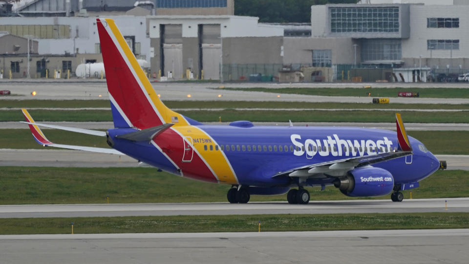 A Southwest Airlines jetliner taxis down a runway at Cleveland Hopkins International Airport, Tuesday, Oct. 12, 2021, in Cleveland. Southwest Airlines appears to be fixing problems that caused the cancellation of nearly 2,400 flights over the previous three days. (AP Photo/Tony Dejak)