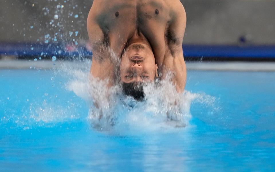 Kyle Kothari enters the water