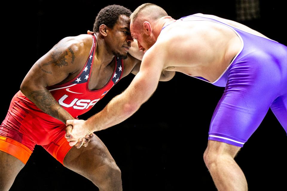 J'den Cox, left) and Kyle Snyder both wrestle on the world stage for the United States, but each of them started in Fargo, N.D. at the freestyle national championships.