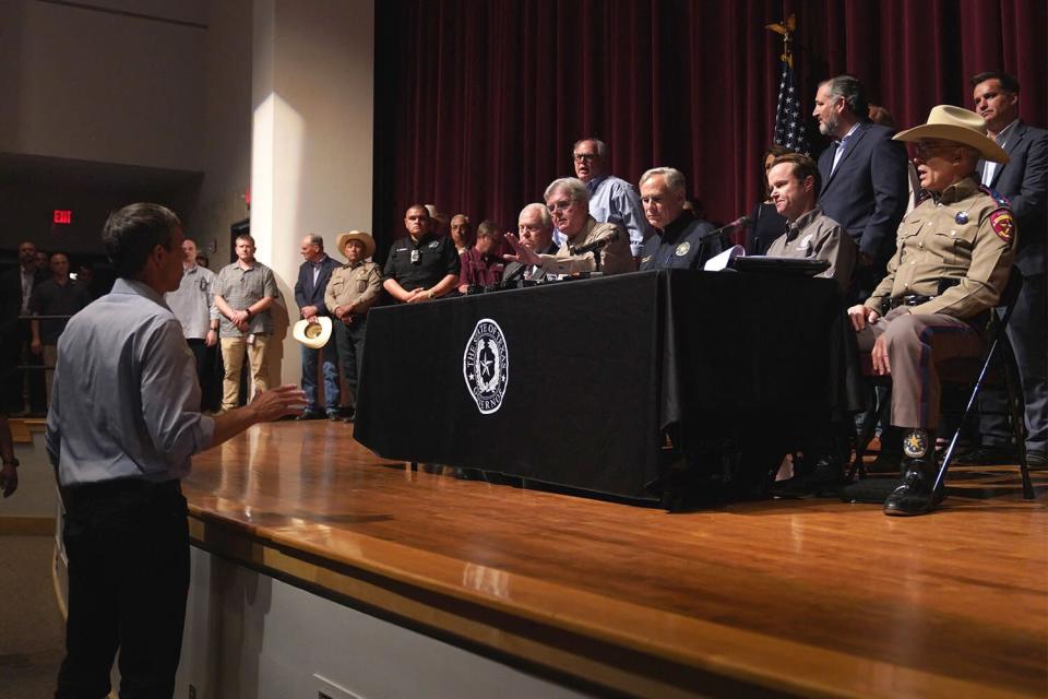 Democratic gubernatorial candidate Beto O'Rourke interrupts Texas Governor Greg Abbott during a press conference at Uvalde High School in Uvalde, Texas on May 25, 2022. - The tight-knit Latino community of Uvalde was wracked with grief Wednesday after a teen in body armor marched into the school and killed 19 children and two teachers, in the latest spasm of deadly gun violence in the US.