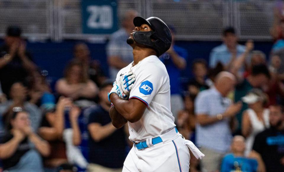 Miami Marlins designated hitter Jorge Soler (12) looks up to the sky before crossing home plate after hitting a home run getting two runs during the third inning of a baseball game against the Washington Nationals on Sunday, Aug. 27, 2023, at loanDepot Park in Miami, Fla.