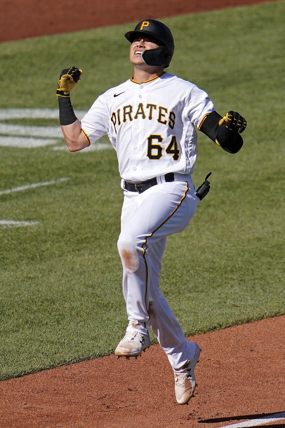 Pittsburgh Pirates' Diego Castillo celebrates as he approaches home plate after hitting a three-run home run off San Francisco Giants starting pitcher Alex Wood during the third inning of a baseball game in Pittsburgh, Saturday, June 18, 2022. (AP Photo/Gene J. Puskar)