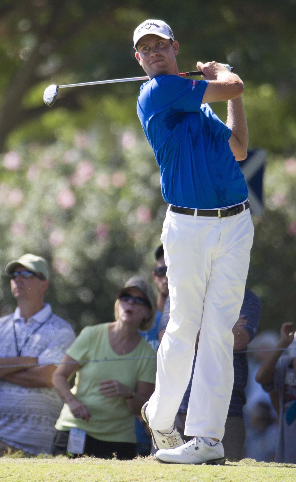 Harris English watches his drive off the second tee during the fourth round of the Sony Open golf tournament at Waialae Country Club, Sunday, Jan. 12, 2014, in Honolulu. (AP Photo/Eugene Tanner)