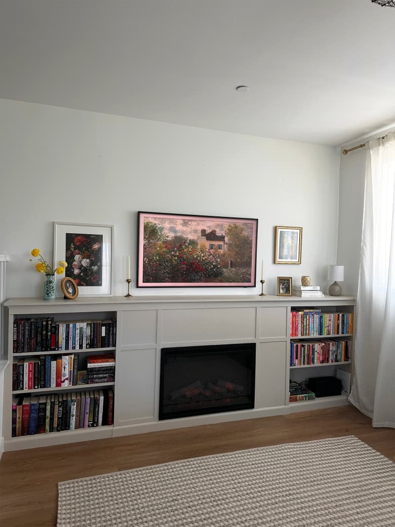 Ikea Billy bookshelf surrounds fireplace.