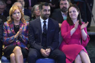 Scottish National Party leader candidates Ash Regan, left, and Kate Forbes applaud as Humza Yousaf, center is announced new SNP leader, at Murrayfield Stadium, in Edinburgh, Scotland, Monday, March 27, 2023. Scotland’s governing Scottish National Party elected Yousaf as its new leader on Monday after a bruising five-week contest that exposed deep fractures within the pro-independence movement. The 37-year-old son of South Asian immigrants is set to become the first person of color to serve as Scotland’s first minister. (Andrew Milligan/PA via AP)