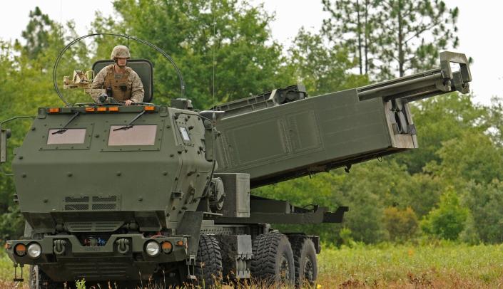 FILE - Marine Corps Sgt. Justin Russell, a High Mobility Artillery Rocket System, or HIMARS, section chief with Kilo Battery, 2nd Battalion, 14th Marines looks out over a firing range at Fort Stewart, Ga. during a training exercise, on June 13, 2015. Ukraine has received about a dozen American-built HIMARS multiple rocket launchers and has used them to strike Russian ammunition depots, which are essential for maintaining Moscow's edge in firepower. (Corey Dickstein/Savannah Morning News via AP, File)