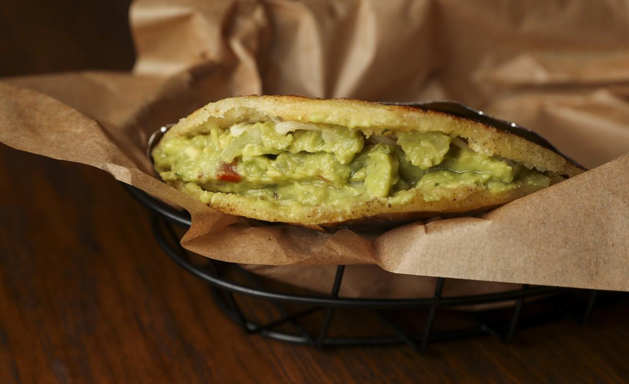 An arepa is seen on Thursday, August 8, 2024, at The Porch in De Pere, Wis. Erly Barajas, owner of Colombian Flavors, partnered with Jackson Mankowski, owner of The Porch, to provide a menu of Colombian-inspired food to go along with The Porch's bar service.