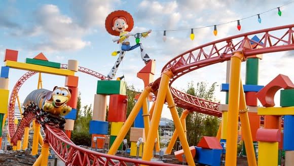 Slinky Dog Dash with  Jessie the Yodeling Cowgirl at Disney's Hollywood Studios under blue skies