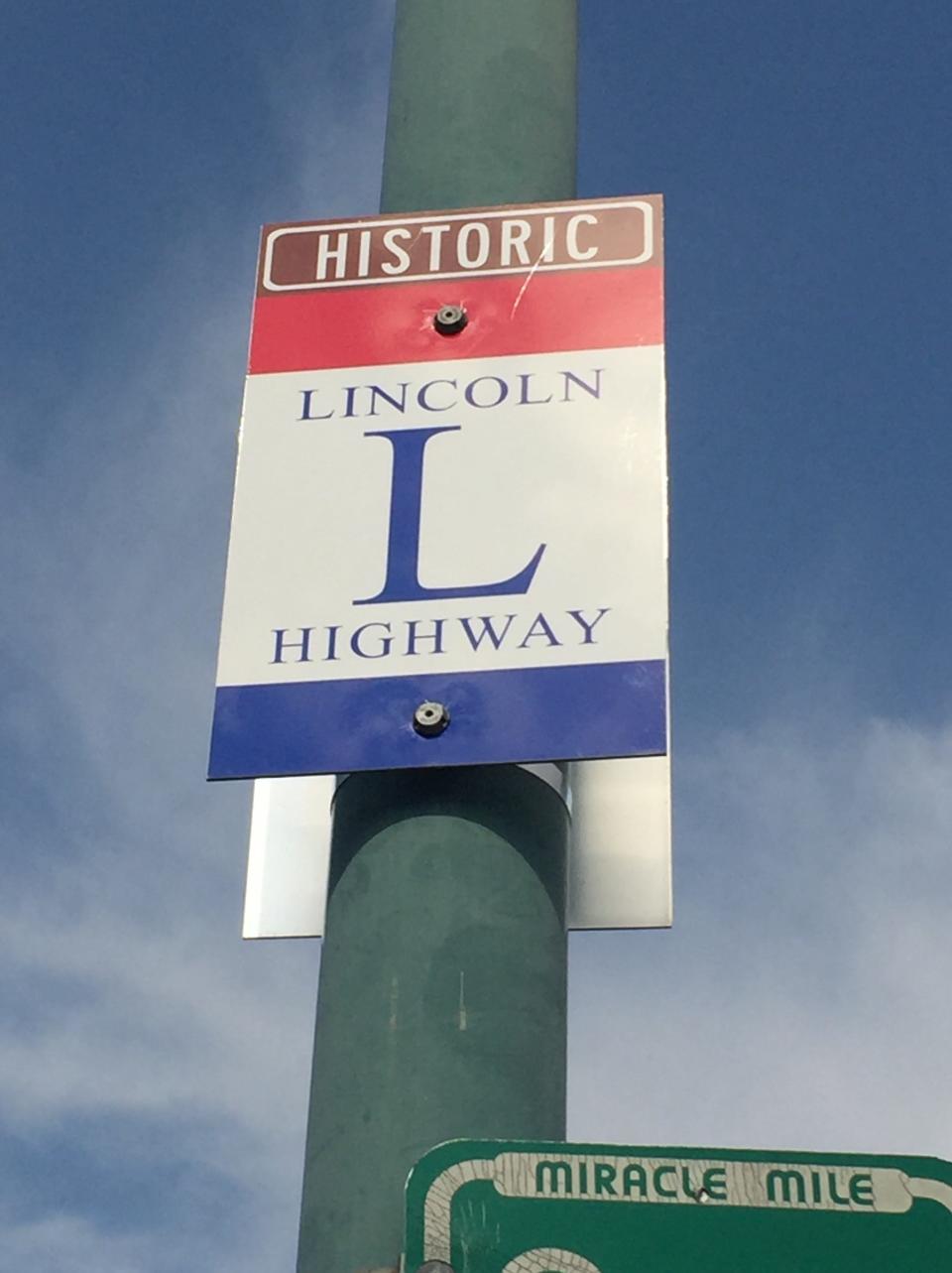 Red, white and blue Lincoln Highway routes signs offer guideposts to the local route.