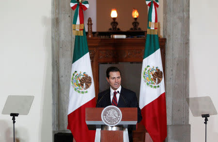 Mexico's President Enrique Pena Nieto speaks to the audience during a meeting with members of the diplomatic corps in Mexico City, Mexico January 11, 2017. REUTERS/Carlos Jasso