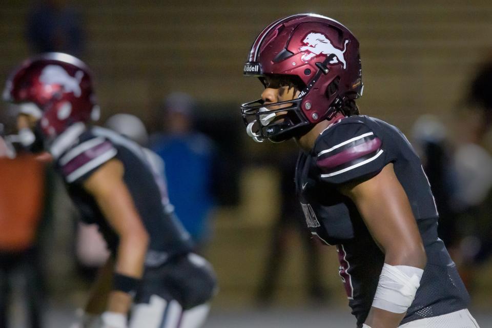 Peoria High linebacker Gary Rutherford gets set as the Lions take on Joliet Catholic in the second half of their Class 5A first-round state football playoff game Friday, Oct. 27, 2023 at Peoria Stadium.
