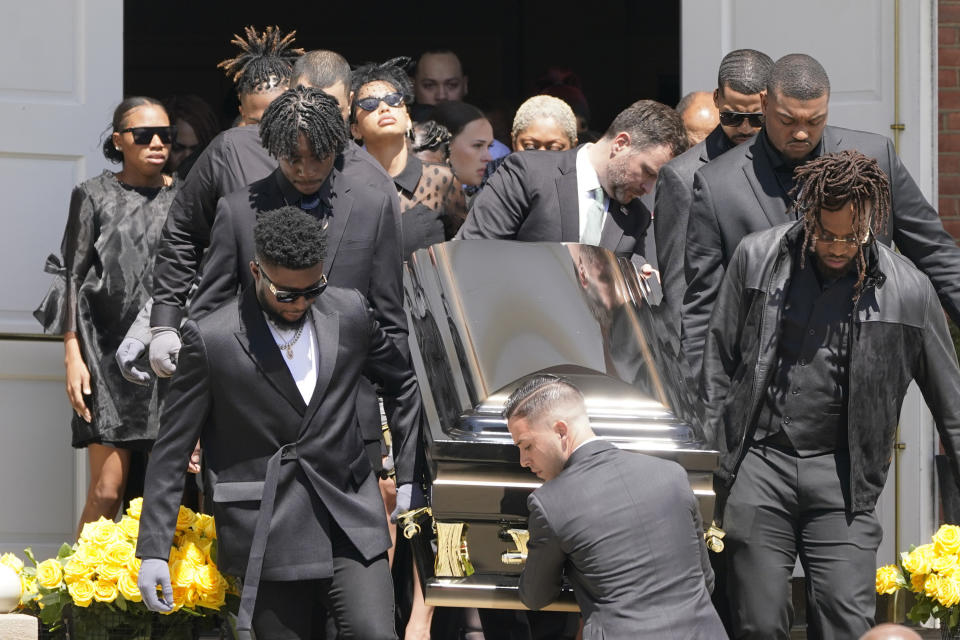 Pallbearers carry the casket of Pittsburgh Steelers NFL football player Dwayne Haskins from a memorial service, Friday, April 22, 2022, in Pittsburgh. (AP Photo/Keith Srakocic)