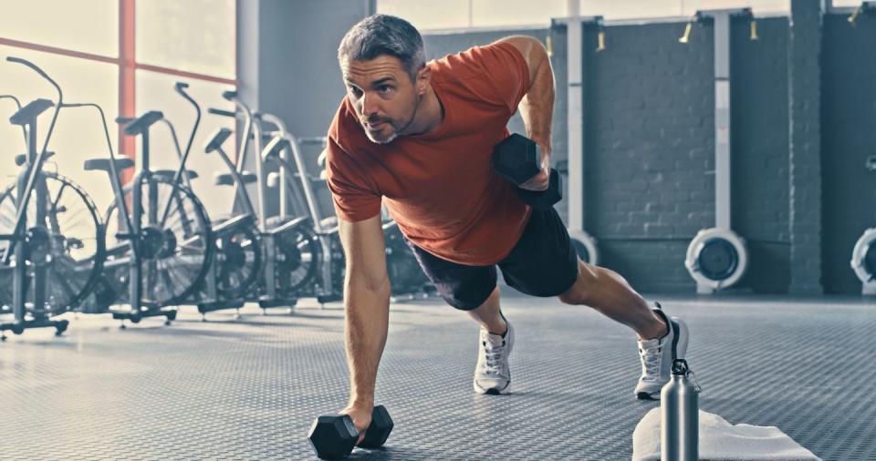 shot of a handsome mature man using dumbbells during his workout in the gym