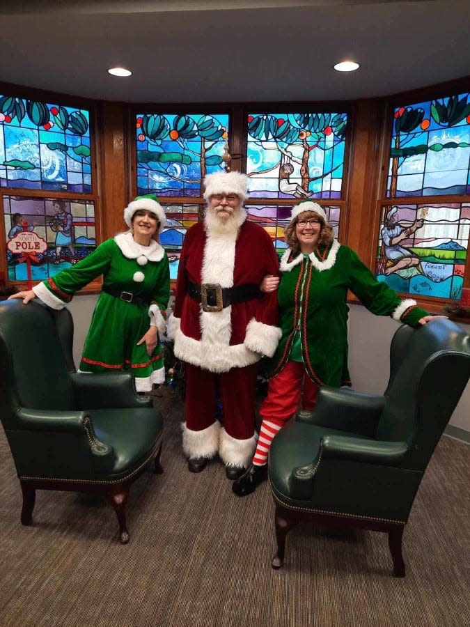 Ambridge couple Bob and Denise Dunn and a distinguished guest shown visiting children of The Bradley Center