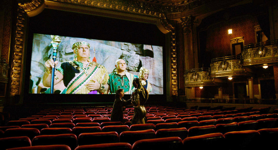 THE SHAPE OF WATER, from left: Sally Hawkins, Doug Jones, on screen: 'THE STORY OF RUTH' - 1960, 2017. /TM & © Fox Searchlight Pictures. All Rights reserved. /Courtesy Everett Collection