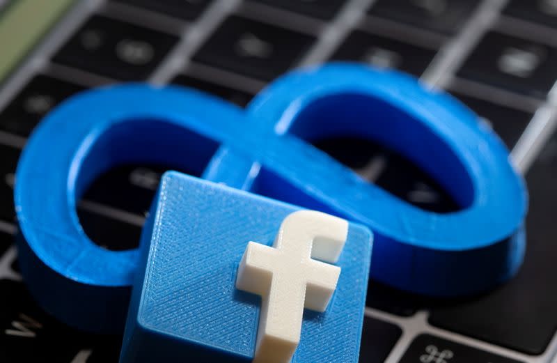 FILE PHOTO: A 3D printed Facebook's new rebrand logo Meta and Facebook logo are placed on laptop keyboard in this illustration