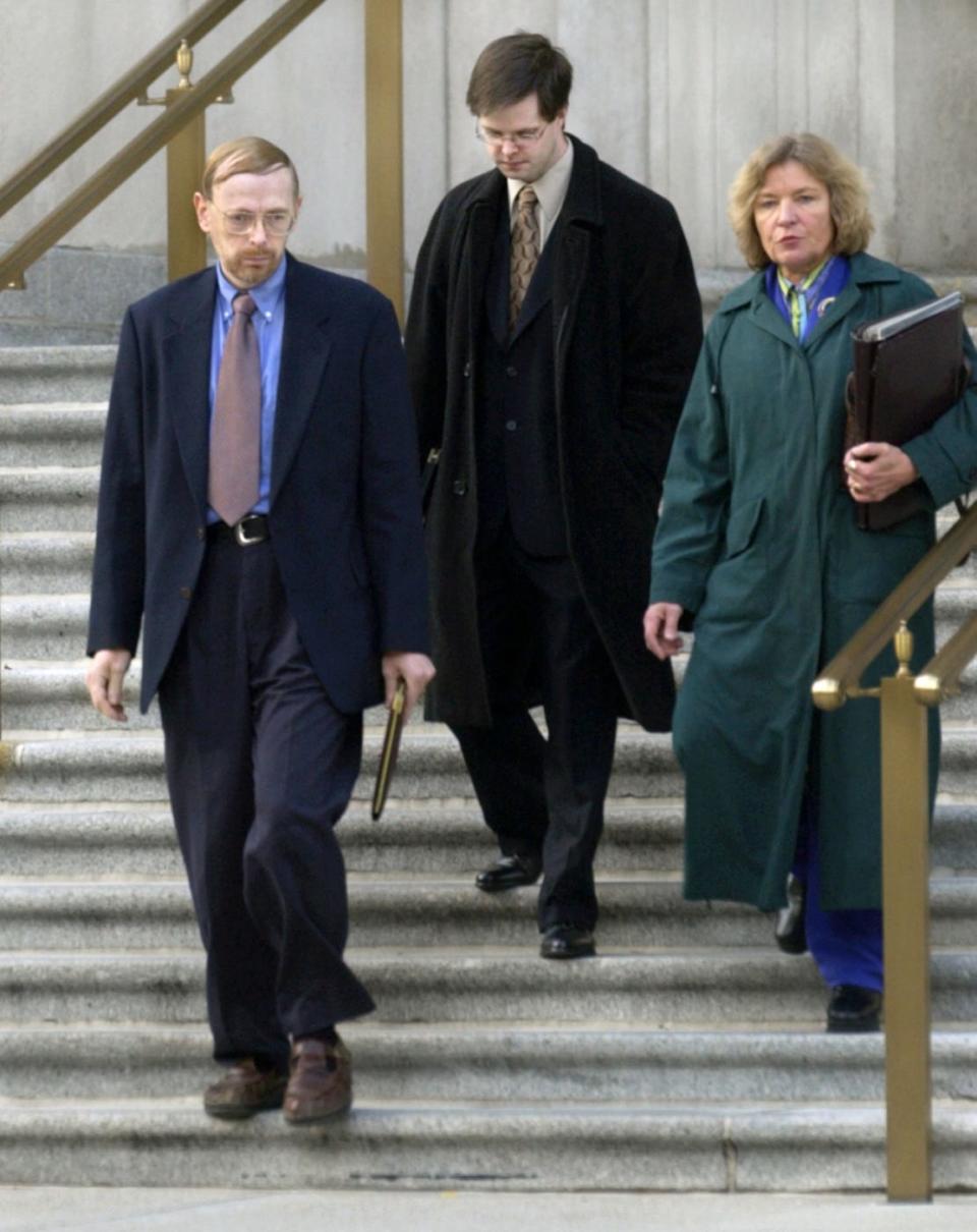 Linda Wagoner (right) walks out of federal court in 2002 with a client.