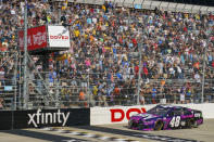 Alex Bowman gets the checker flag as he finishes first during a NASCAR Cup Series auto race at Dover International Speedway, Sunday, May 16, 2021, in Dover, Del. Alex Bowman wins the race. (AP Photo/Chris Szagola)