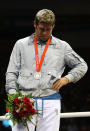 BEIJING - AUGUST 23: Silver medalist Clemente Russo of Italy shows his emotions as he stands on the podium during the medal ceremony Men's Heavy (91kg) Final Bout held at Workers' Indoor Arena on Day 15 of the Beijing 2008 Olympic Games on August 23, 2008 in Beijing, China. (Photo by Nick Laham/Getty Images)